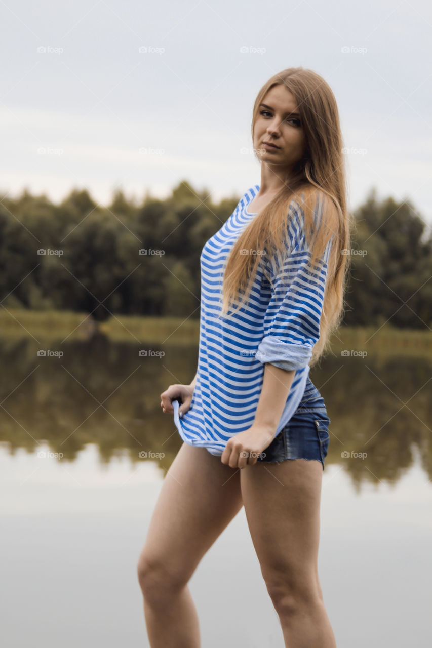 A girl with blond hair on the lake in a striped shirt and short denim shorts on the background of grass, reeds and an old wooden boat
Girl, woman, people, blonde, blonde hair, striped shirt, short shorts, denim shorts, shore, lake, grass, reeds, old boat, feelings, emotions, tenderness, love, lifestyle, lifestyle, vacation