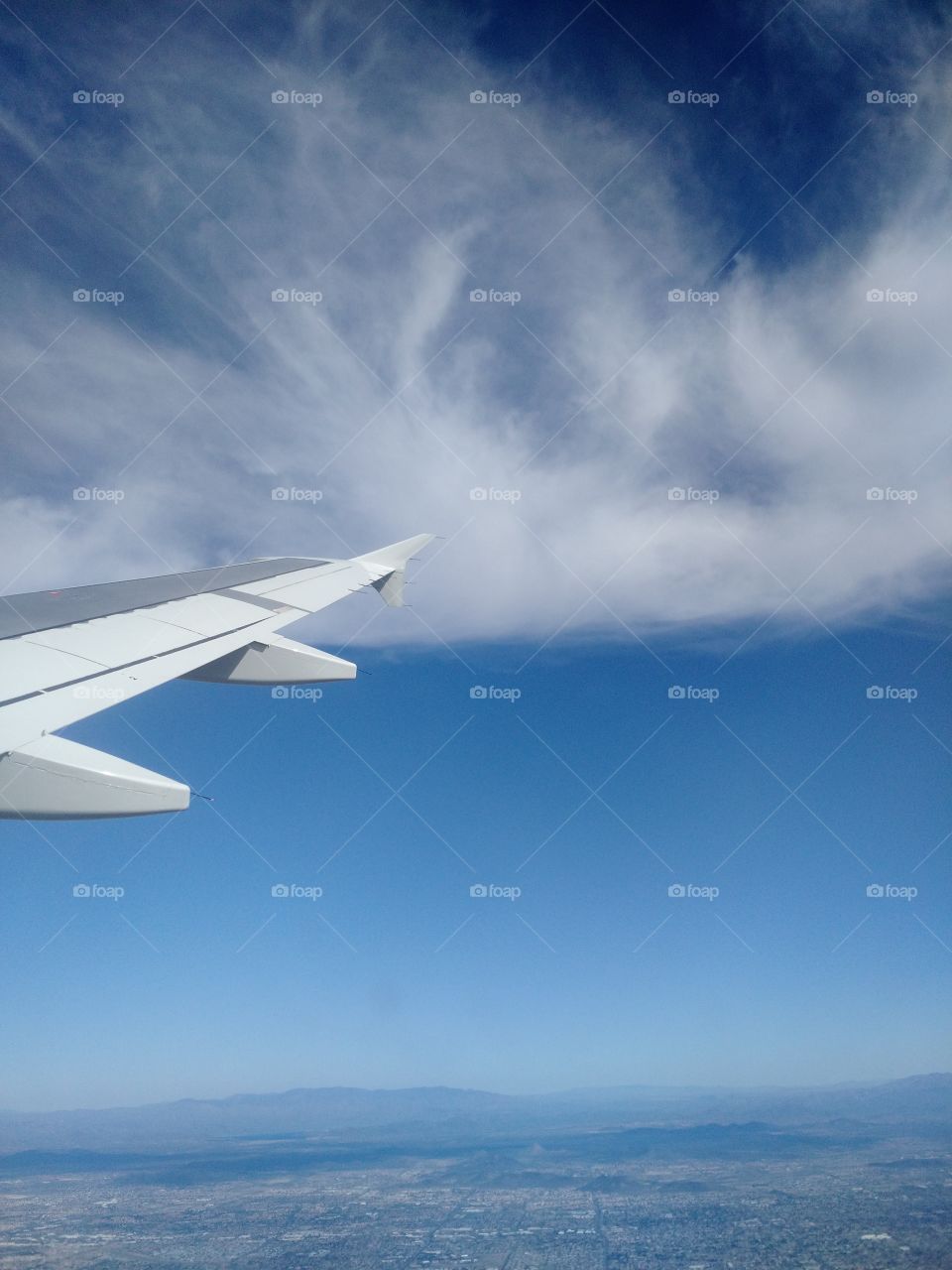 airplane in the clouds. us airways