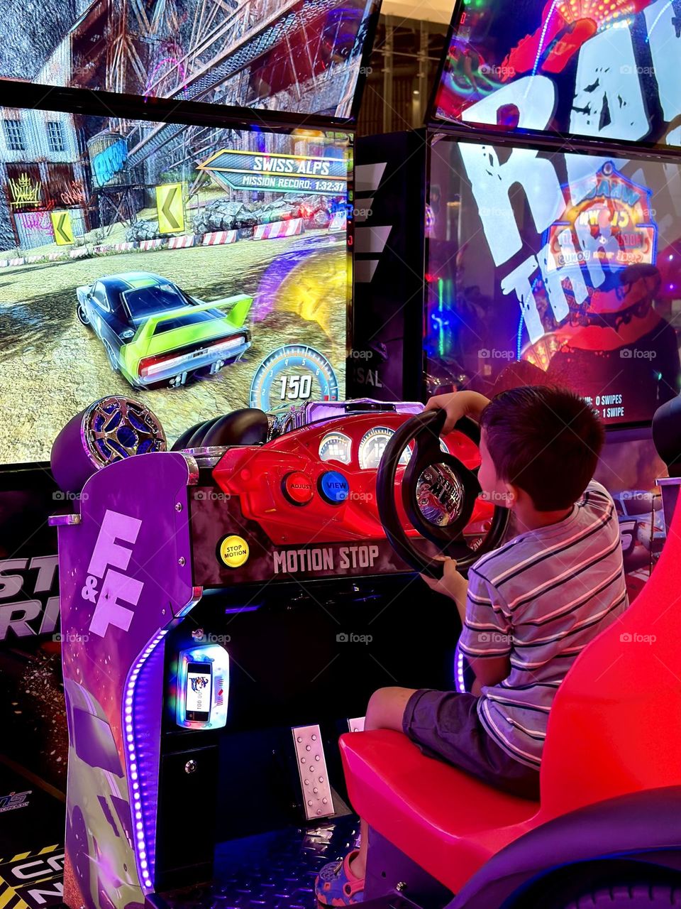 Boy playing car racing video game