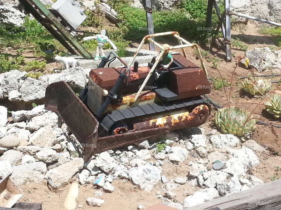 Toy bulldozer in a scwne