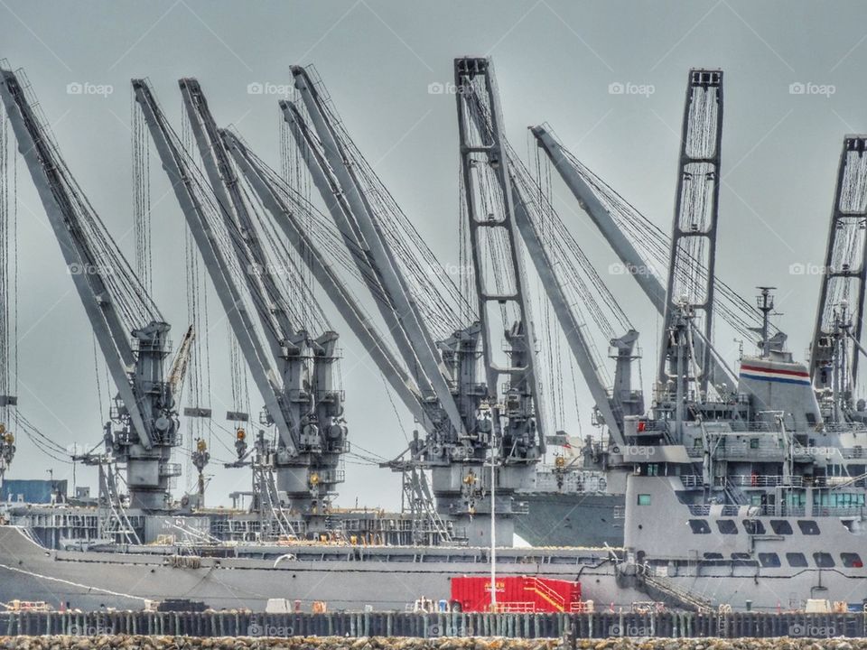 Industrial Cranes In A Port. Cargo Loading Cranes At A Seaport
