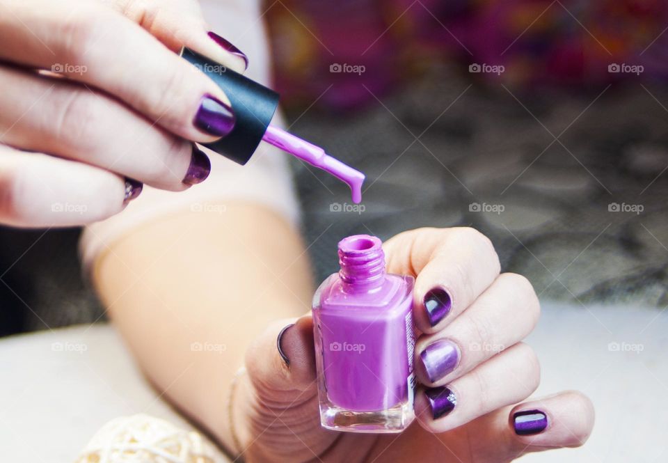 woman doing manicure