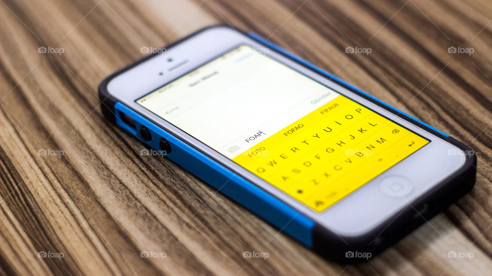 Close-up of smartphone on wooden table