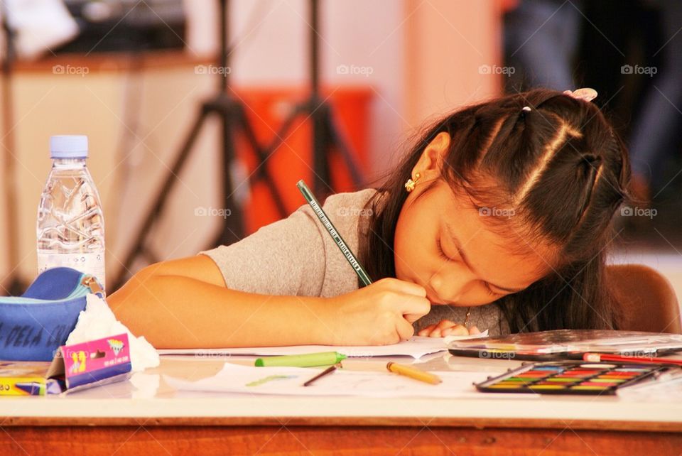 A girl working on an artwork