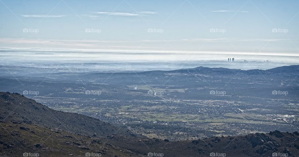 Madrid city on the background of a foggy landscape 
