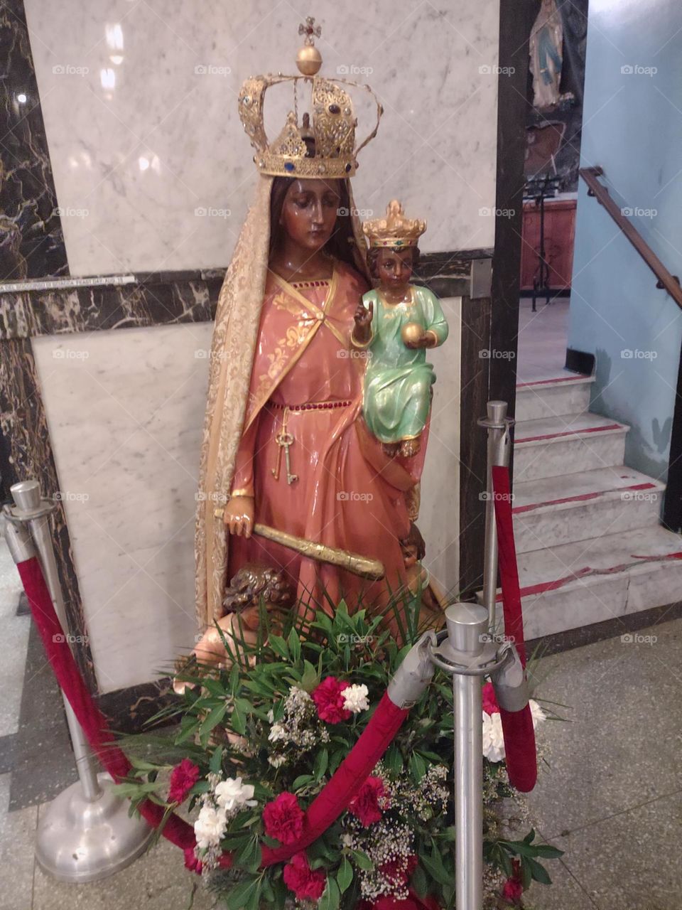 The Virgin Mary wielding a club. When some visitors saw this version of the Madonna and child statue; they said, "Ooh, she's not playin'!"