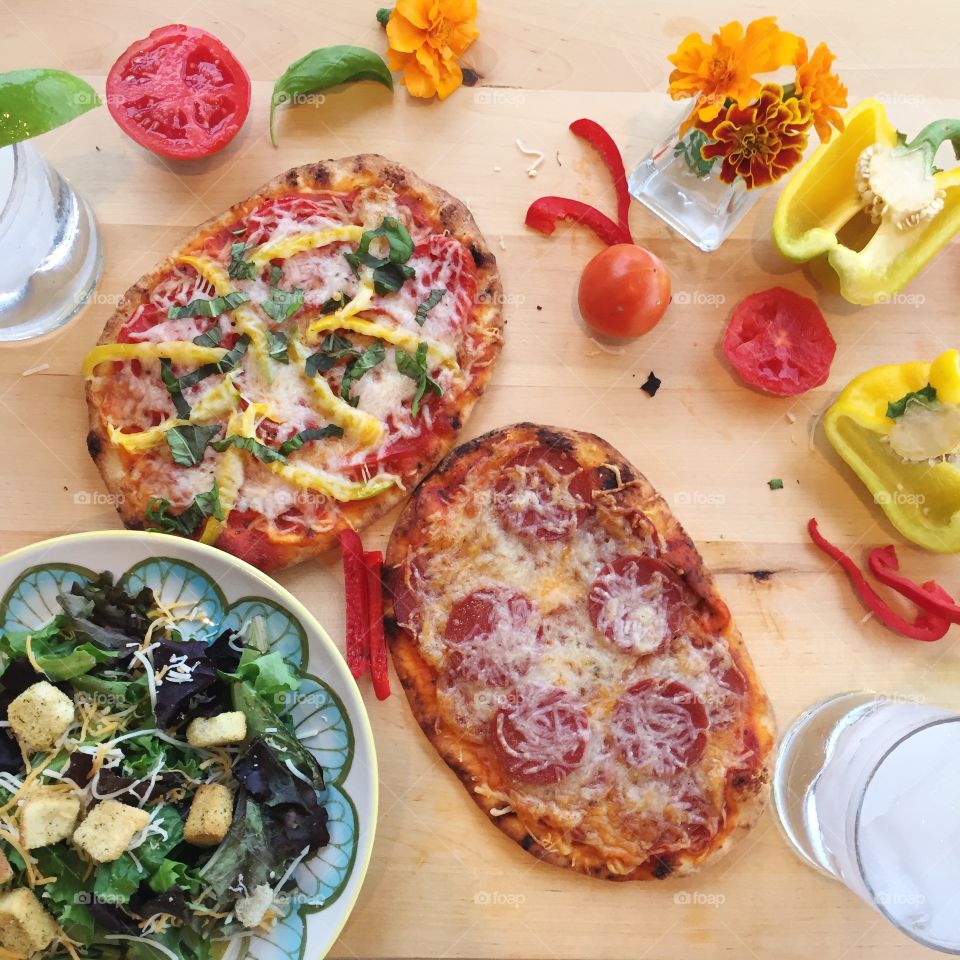 Homemade flatbread pizzas with garden fresh veggies. So good!
