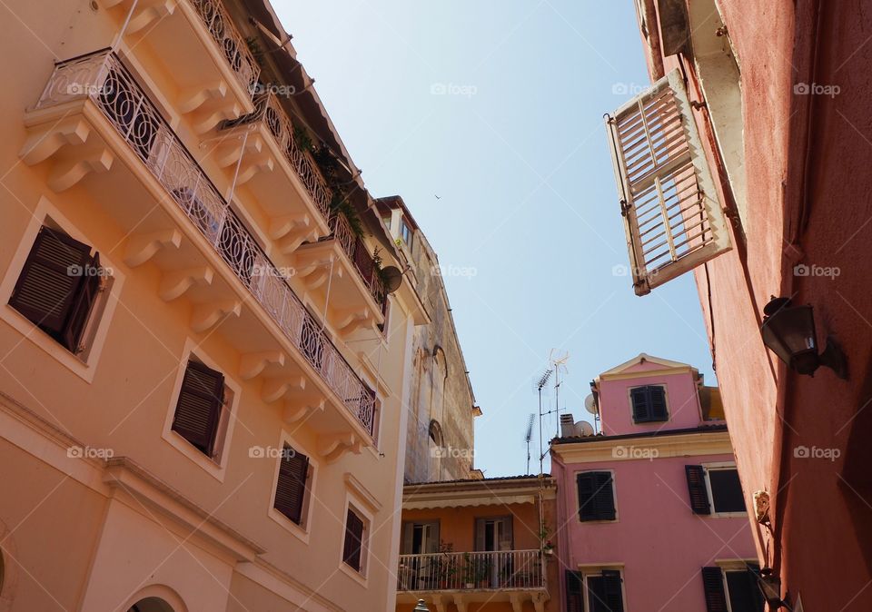 Corfu Town rooftop view and open window shutter, Greece