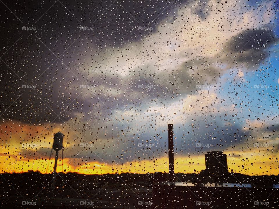 Looking out at Durham, NC through a rain drop covered window. 