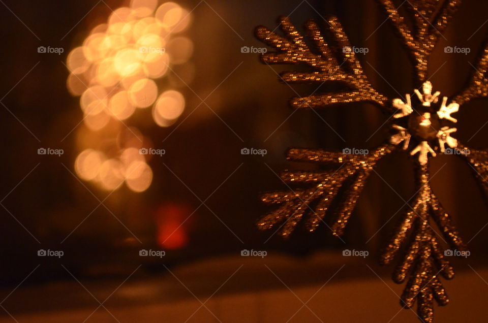 Twinkling lights of Christmas. Glittery snowflake 