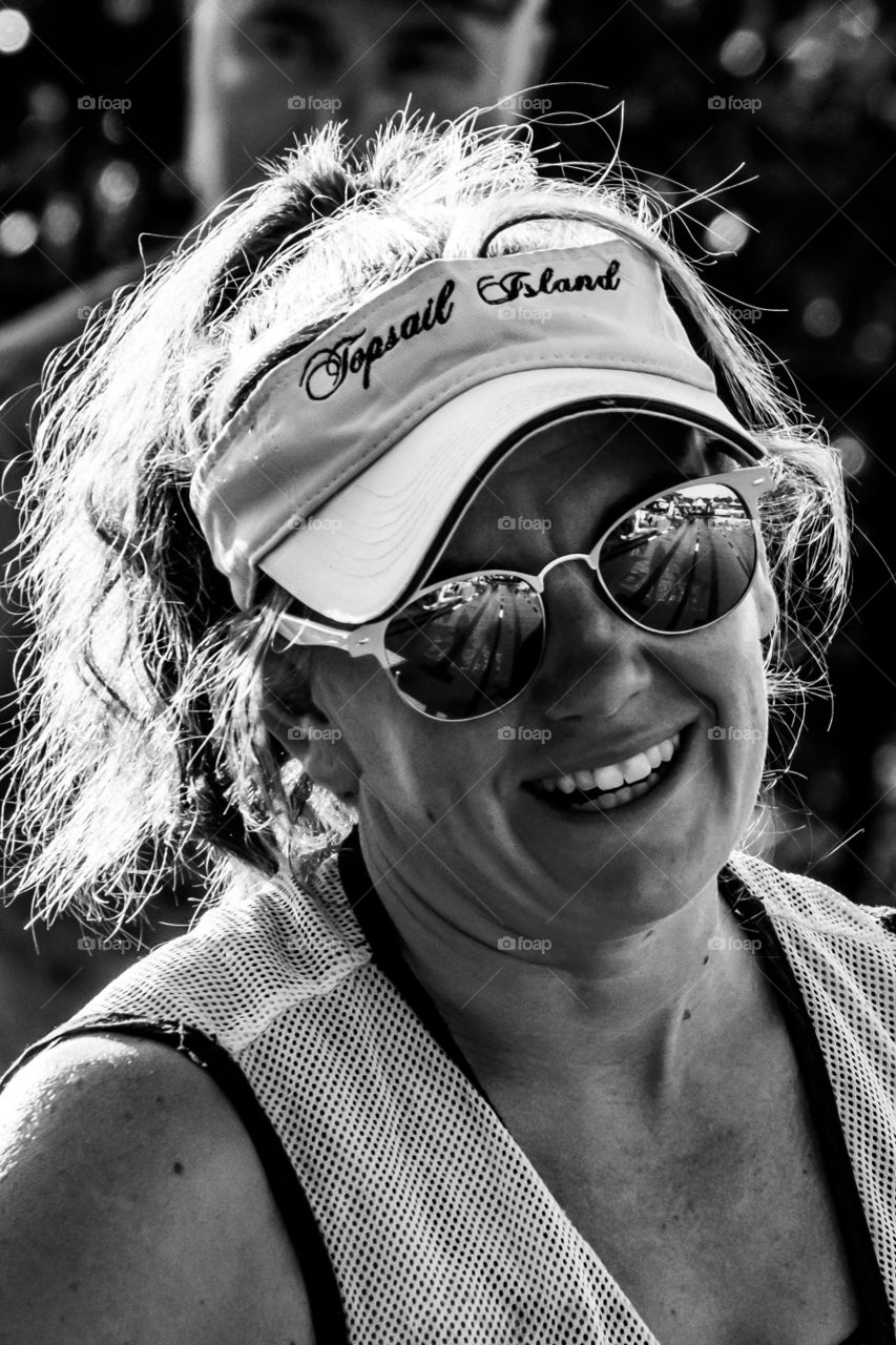 Foap, Black and White vs Color: A very upbeat young lady volunteering at a swim club meet for the children. 