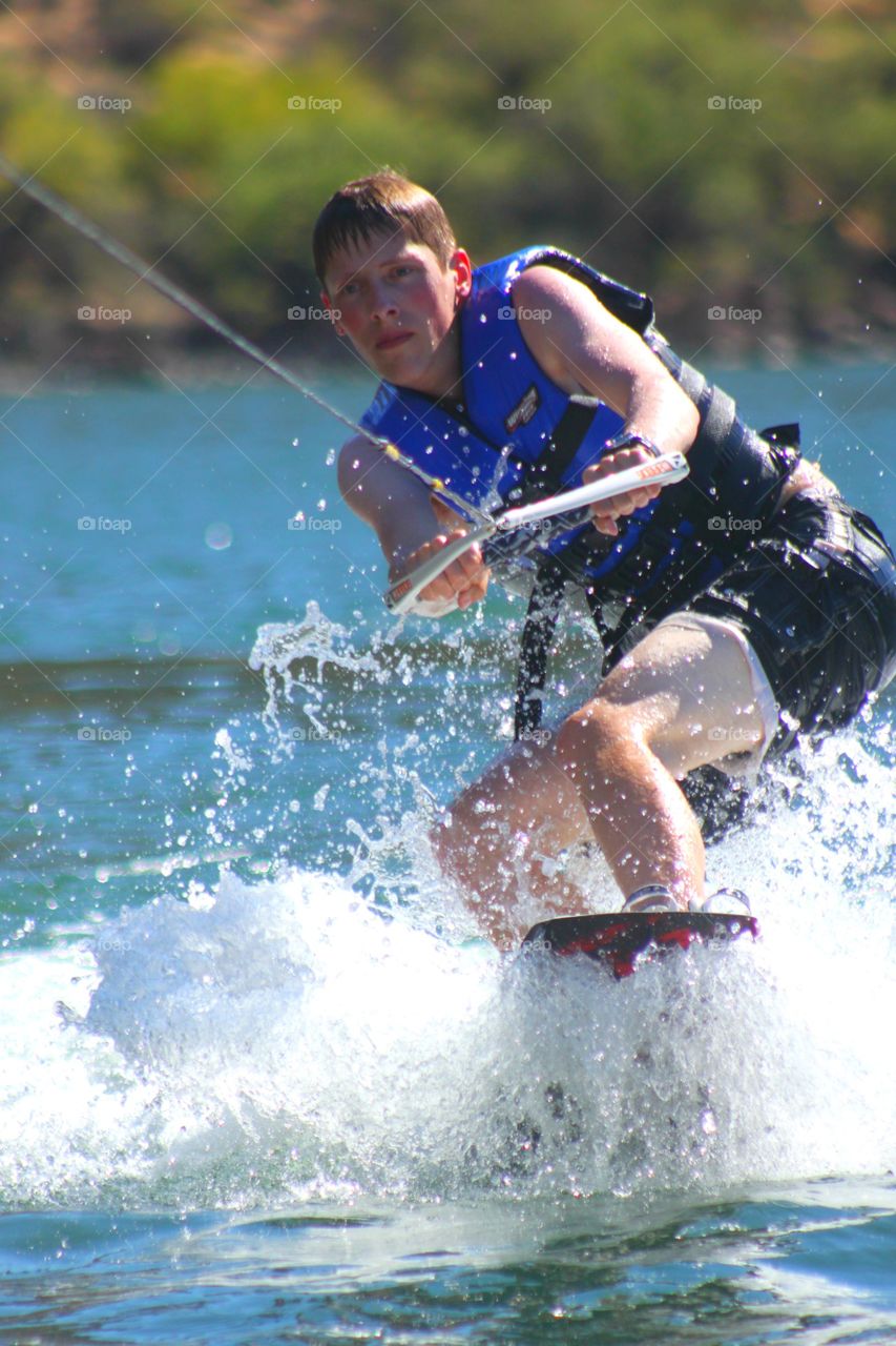 Man surfing with paraglide