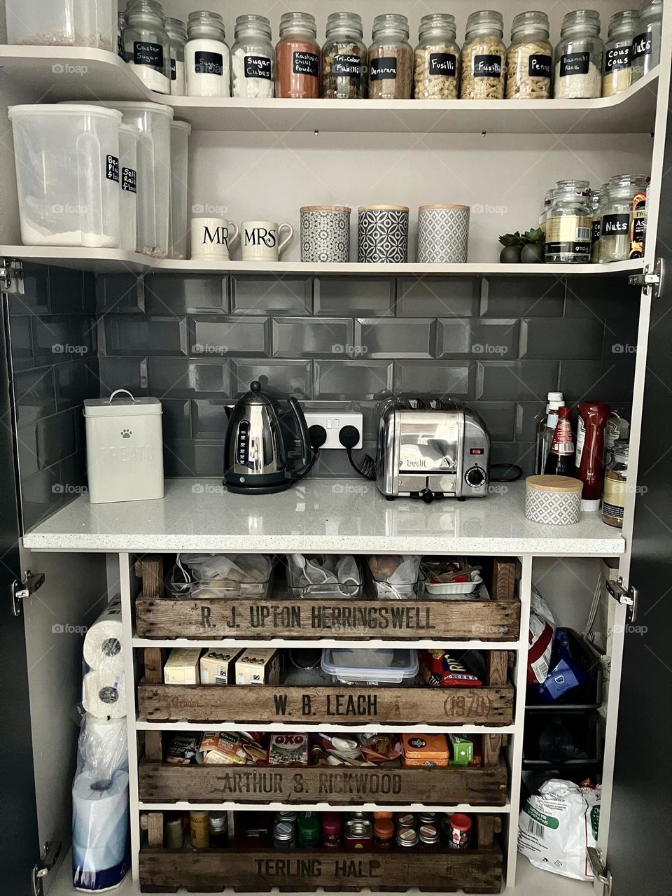 My DIY drawers for my pantry, they are huge.  I made them from farm crates which I sanded down, treated and waxed … my favourite is the bottom drawer where I store all my spice jars ! Top shelf Coffee Jars washed and labelled are also my handiwork 