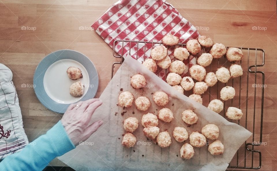 Person preparing cookie in kitchen