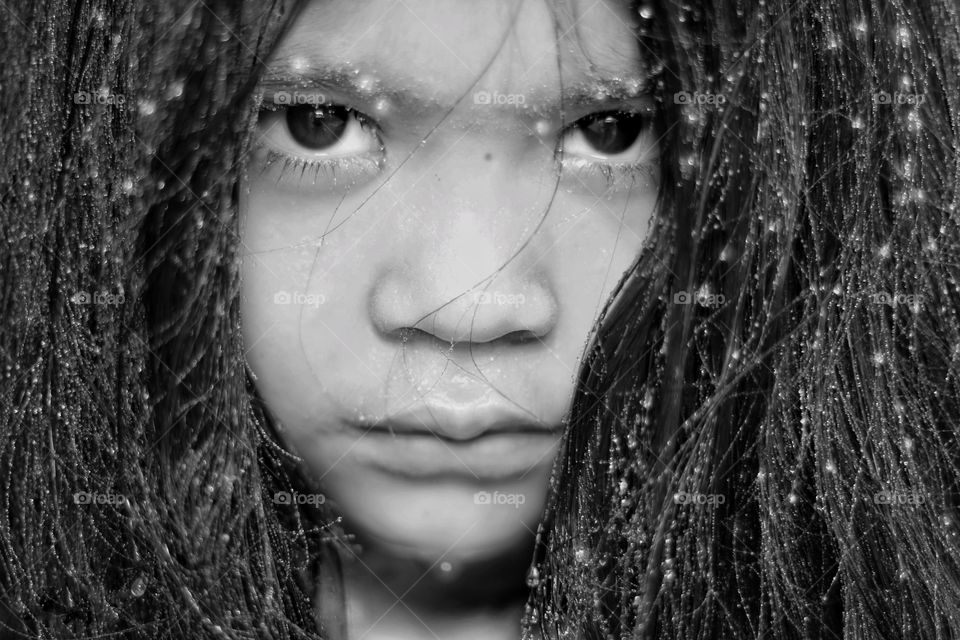 Close-up of girl with water drops on her face