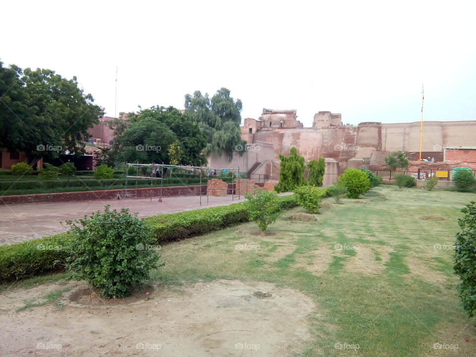 a little boy playing in an ancient fort of Bathinda city- a monument protected by Govt Of India- inner part