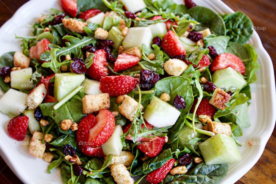 High angle view of strawberry spinach salad