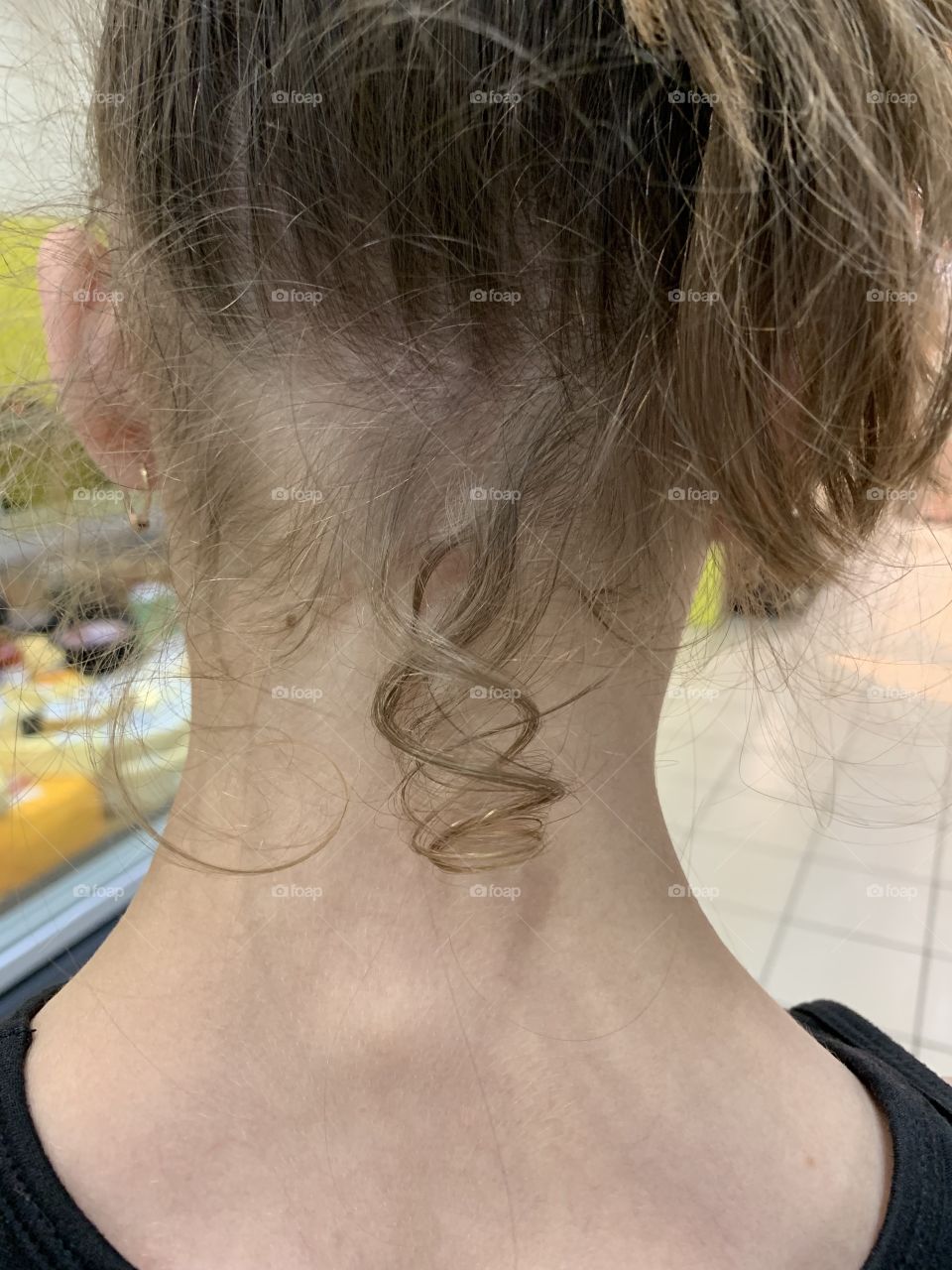 curly on the girl's neck