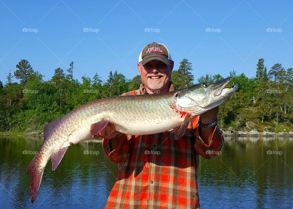 Portrait of man holding big fish