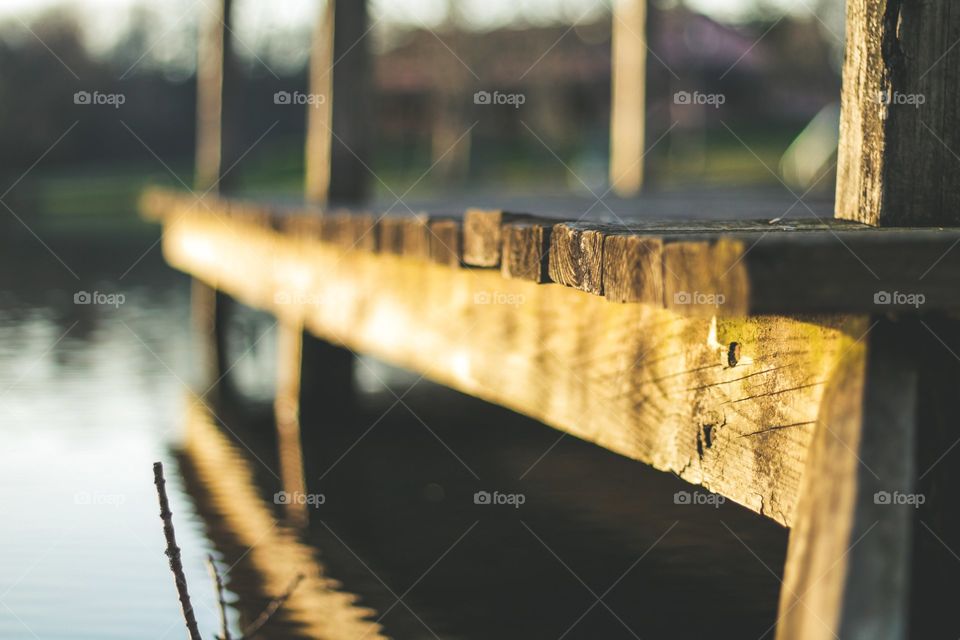 Cool perspective view of a dock looking out onto a beautiful lake.