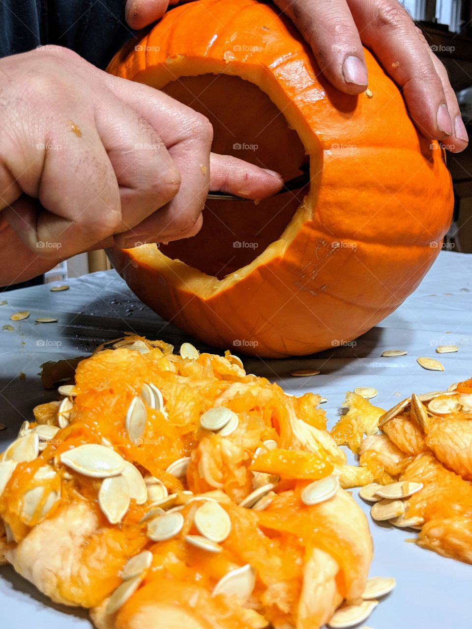 process of carving a pumpkin