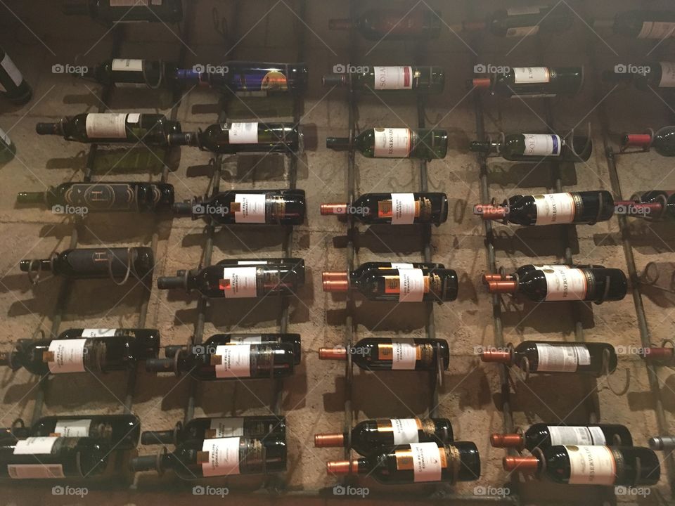 Bottles of wine on wall