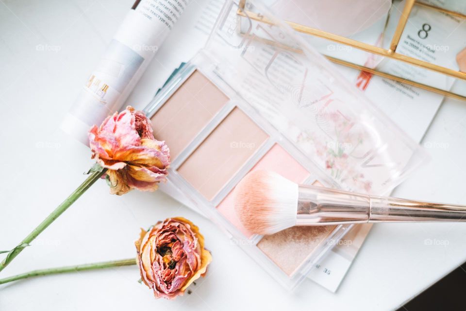 Makeup products on window sill