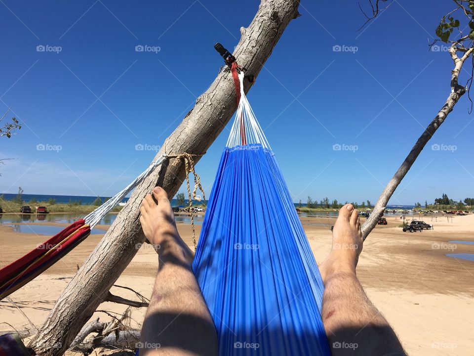 Laying in a hammock on silver lake sand dunes 