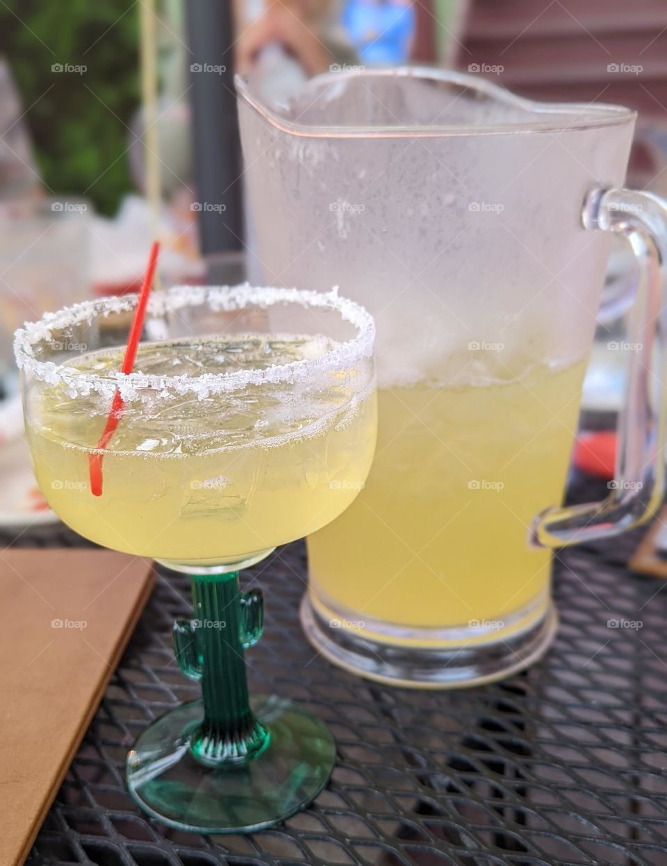 refreshing classic margarita on the rocks in the summer cactus glass pitcher