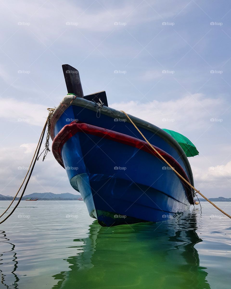 The blue boat on the sea