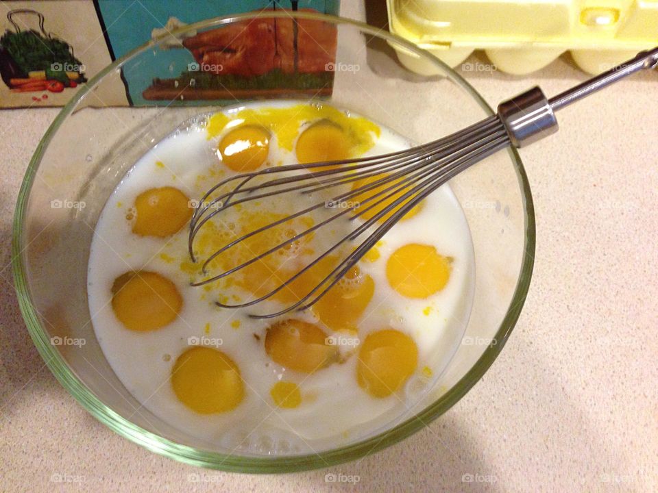 Yellow egg yolks ready to whisk.