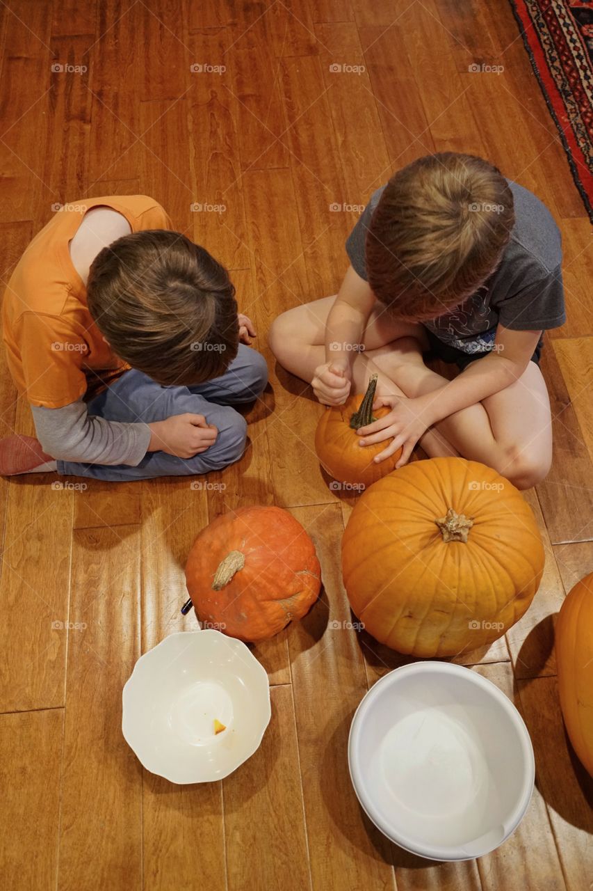 Young Brothers Carving Halloween Pumpkins