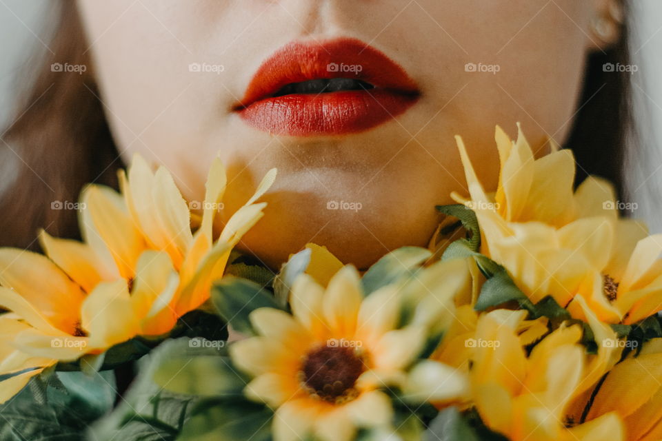 Red lipstick and sunflowers