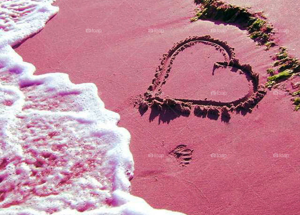 Heart shape on sand at beach