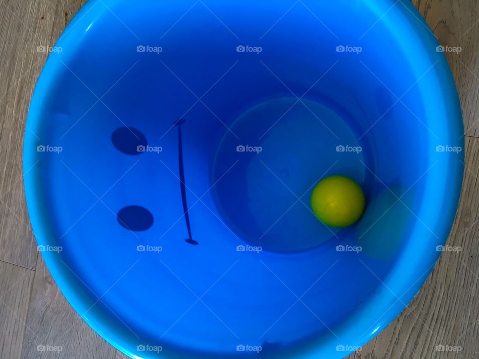  Yellow ball in a bucket 