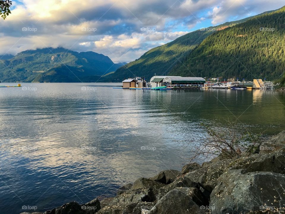 View across Harrison lake at Harrison Hotsprings resort, Marina and boathouse in distance, dusk