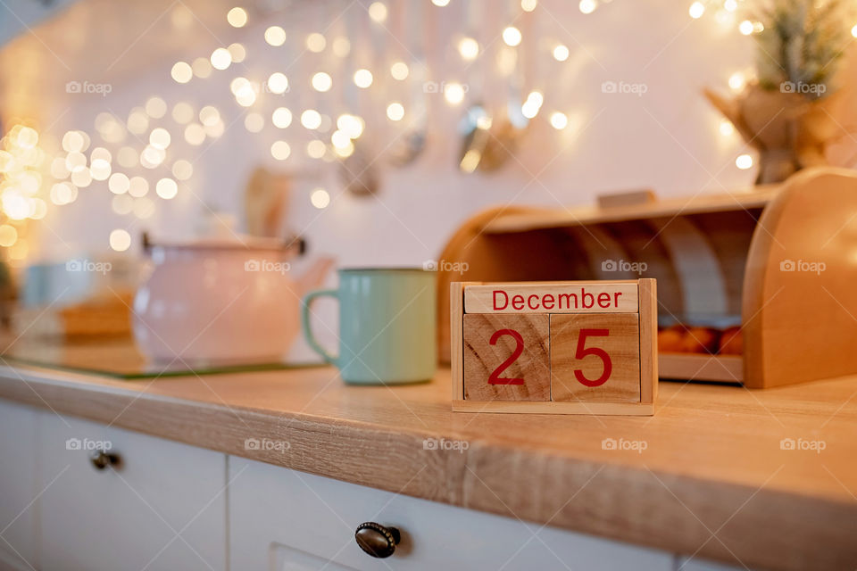 Christmas background with wooden block calendar with the date of December 25