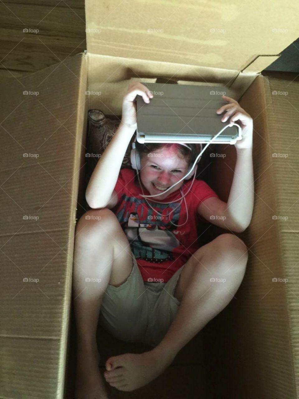 Child in a Cardboard Box