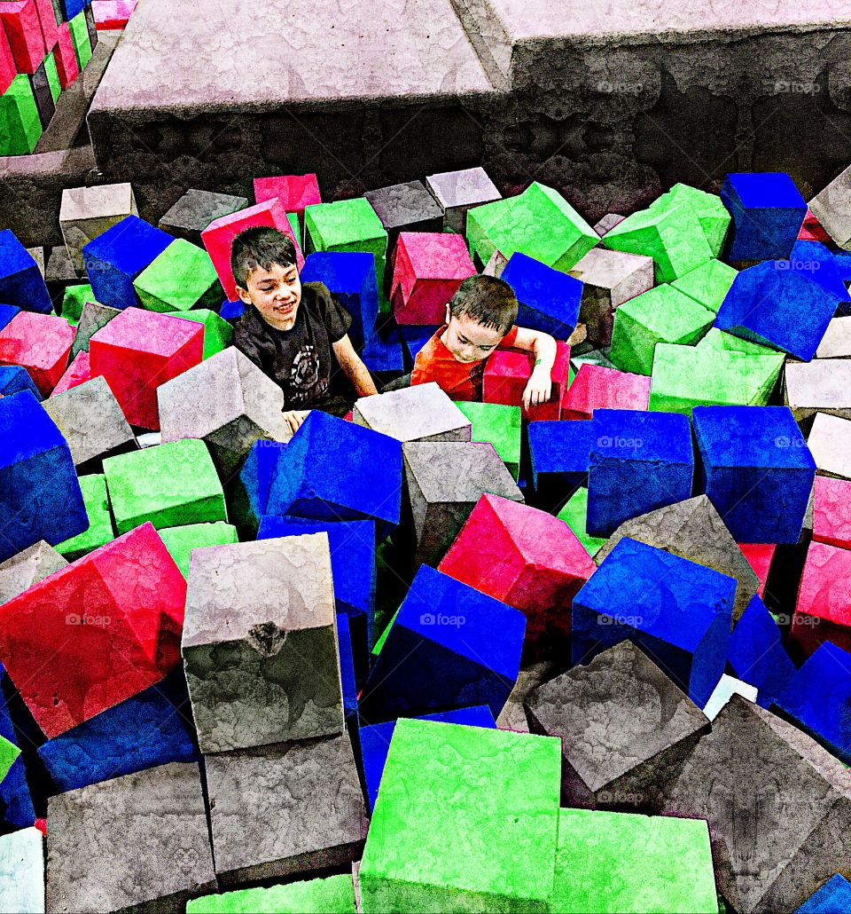Super humain kids playing in rock solid cubes