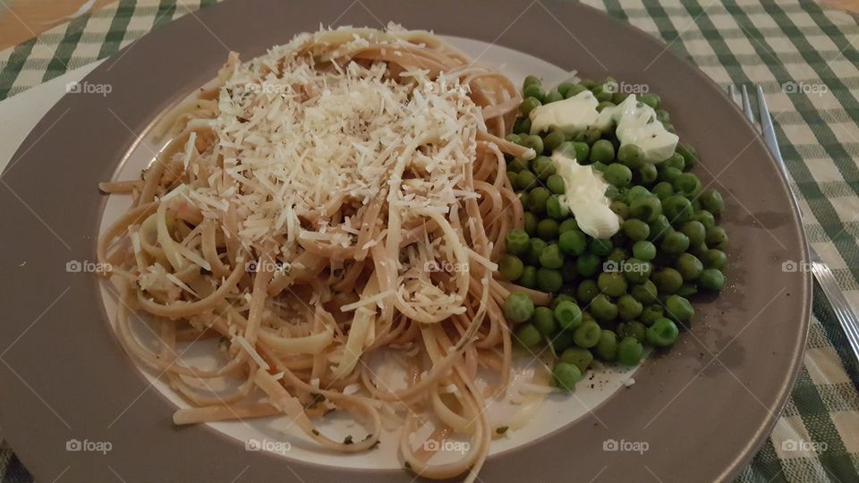 Shrimp and Clams with Wheat Linguine and freshly grated Parmesan cheese with a side of buttered peas.