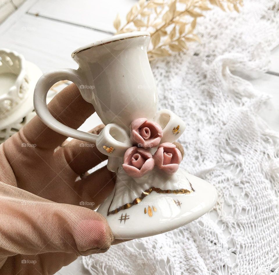 Vintage porcelain candlestick with handle and porcelain roses