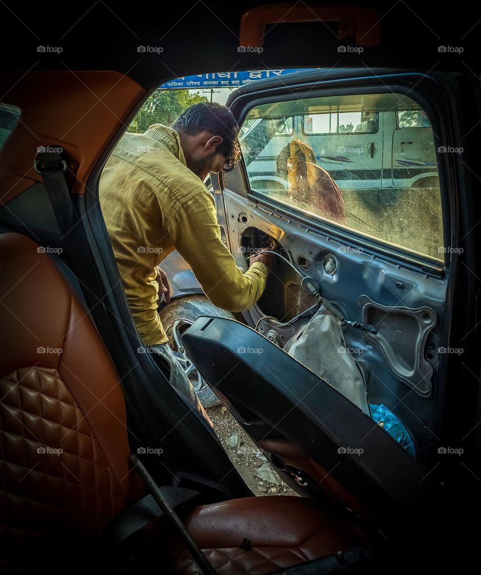 Mechanic making the car door