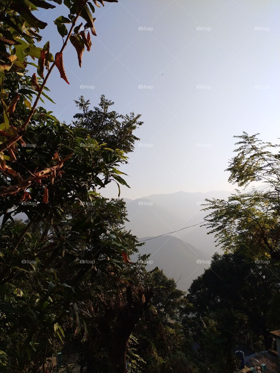 View of distant mountains wrapped in mists