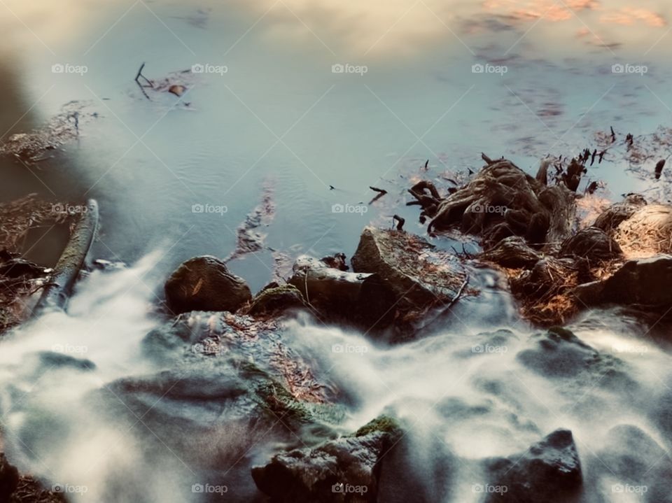 Mini waterfall flowing at local lake. Riverside, California. 