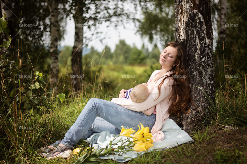 Woman with her child resting in park