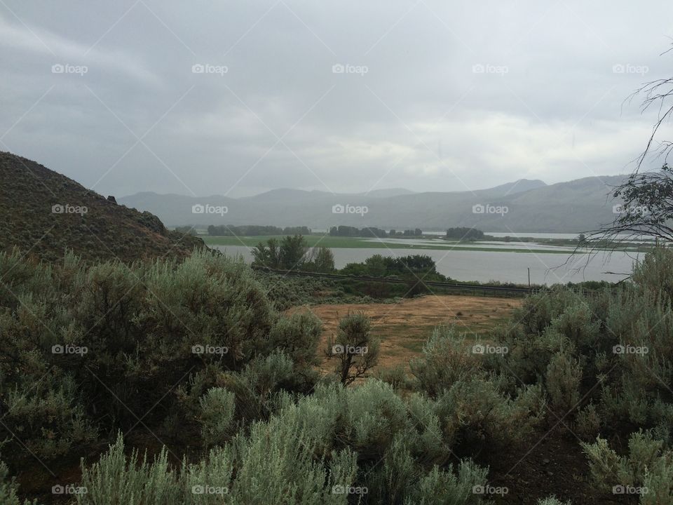 Beautiful scenic mountain view of flooded farm land 