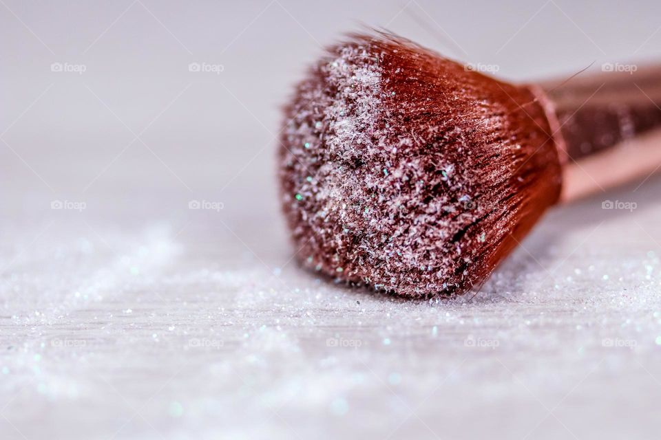 Makeup brush with white sparkles