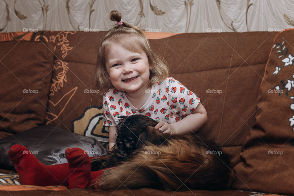girl and her dog Pekingese