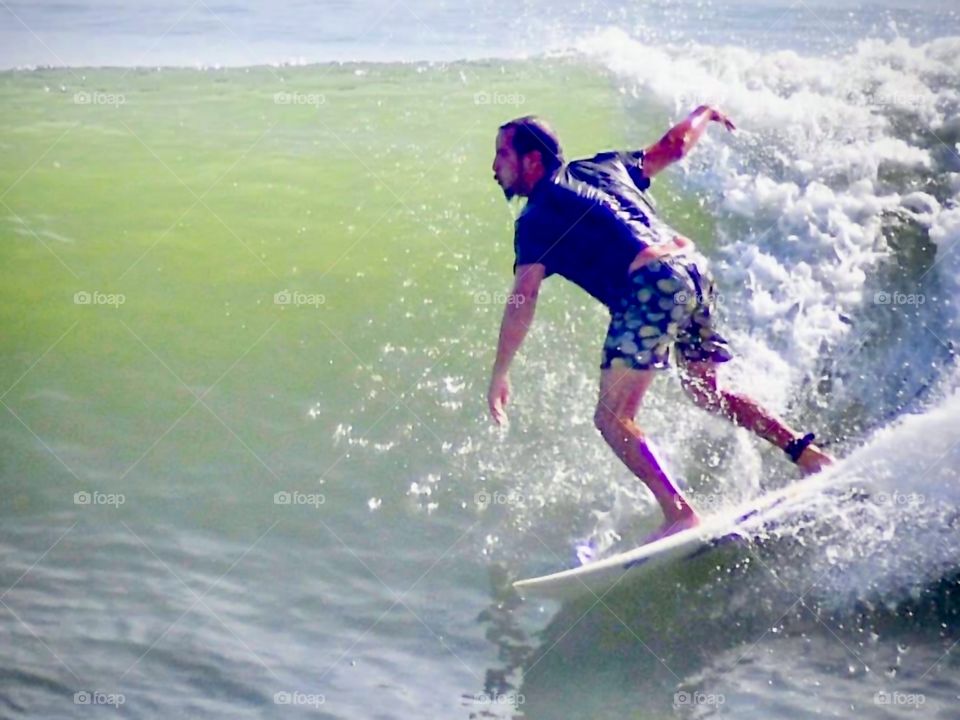 Man surfing in the sea of ​​northeastern Brazil