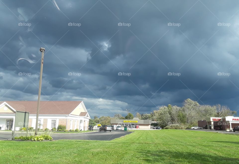dark skies, green grass